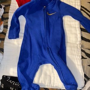 Blue Nime Onesie With Gold Nike Sign